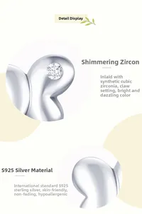 Macro detail of S925 sterling silver butterfly earring with prong-set cubic zirconia