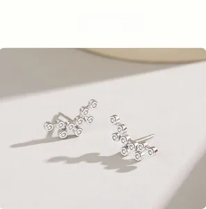 Detailed close-up of s925 silver bubble earrings with sparkling cubic zirconia stones