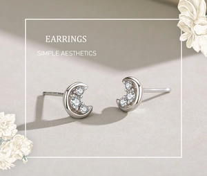 Macro shot of S925 sterling silver moon earrings with three zircon stones inlay