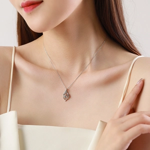 Elegant S925 sterling silver necklace with a sparkling solitaire pendant on a female model