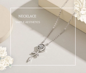 Detail of s925 silver rose necklace featuring a central zircon stone and leaf accents