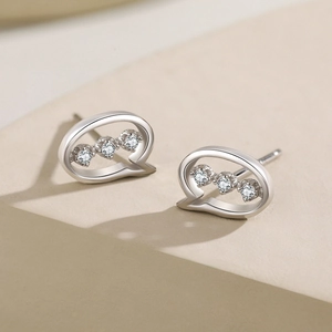 S925 sterling silver chat bubble earrings with three sparkling zircons on white display