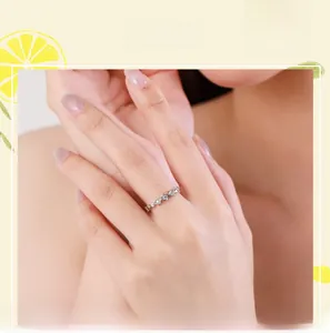 Close-up of s925 sterling silver star ring with micro-pave zircons on a model's finger