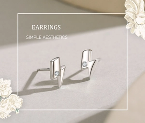 Macro shot of minimalist S925 sterling silver lightning bolt studs with zircon micro-inlay