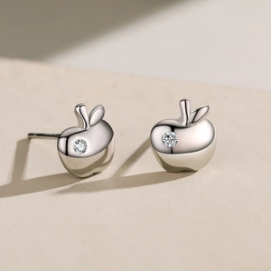 Polished S925 sterling silver apple stud earrings with sparkling central zirconia stones