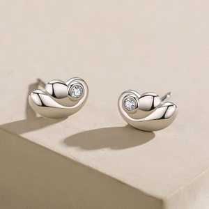 Minimalist S925 sterling silver angel wing stud earrings with sparkling zircon accents