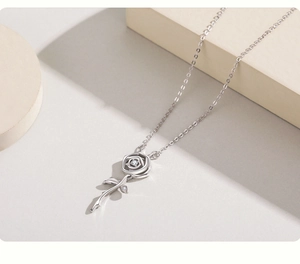 Detailed close-up of S925 sterling silver rose pendant necklace with cubic zirconia stones