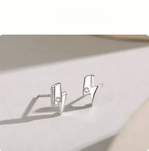 Close-up of S925 sterling silver lightning stud earrings with sparkling cubic zirconia