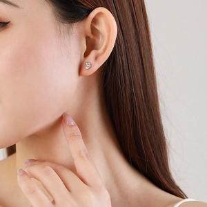 Elegant S925 sterling silver moon stud earrings with zircon worn by a female model