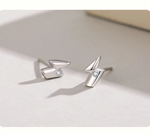 Macro detail of S925 sterling silver lightning stud earrings with sparkling cubic zirconia