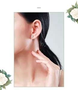 Close-up of elegant S925 sterling silver square stud earrings worn by a model