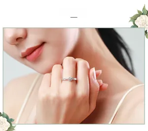 Close-up of S925 sterling silver ring with brilliant round zircon on female finger
