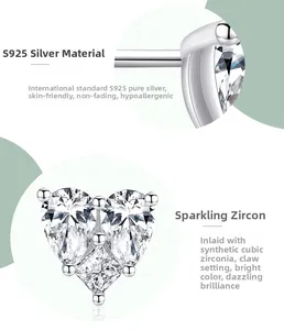 Macro detail of S925 sterling silver stamp and prong-set cubic zirconia heart studs