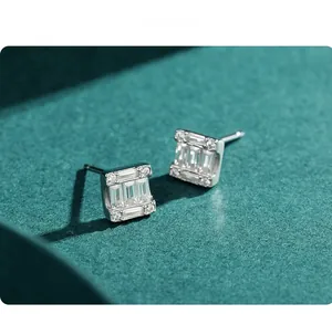 Macro detail of square emerald-cut S925 silver stud earrings with micro-paved accents