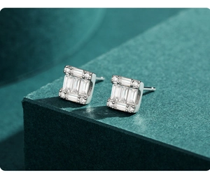 Macro view of S925 sterling silver geometric stud earrings with pavé diamond setting