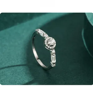 Macro view of S925 silver ring featuring round halo zircon and baguette side stones