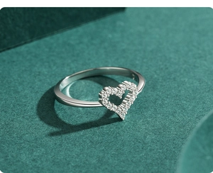 Macro side view of hollow heart s925 silver ring with pave-set sparkling cubic zirconia