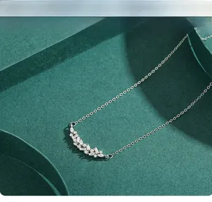 Detail view of S925 silver necklace with marquise and round cubic zirconia in cluster setting
