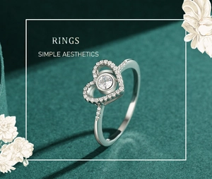 Macro d'une bague cœur en argent S925 avec pavé de diamants sur velours vert foncé