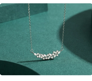 Macro shot of S925 sterling silver necklace with multi-cut zircon curved pendant