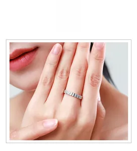 Close-up of minimalist 925 sterling silver ring with micro-pave square zircon on a finger
