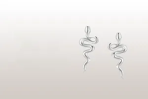 Detailed view of s925 sterling silver snake stud earrings with a polished finish