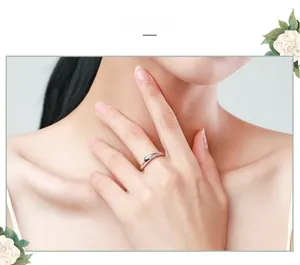 Close-up of minimalist s925 silver ring with micro-set diamonds on model's hand