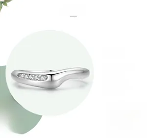 Macro view of sterling silver wave ring with five micro-inlaid round cubic zirconia stones