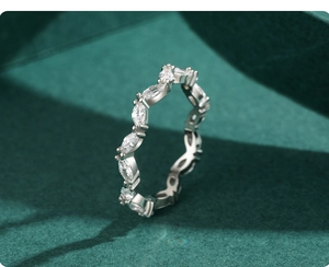 Macro view of marquise-cut stones set in an S925 sterling silver luxury wedding ring