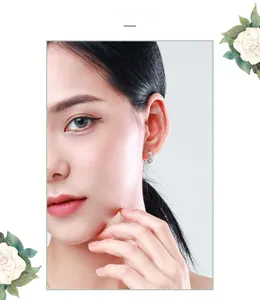 Close-up of s925 sterling silver hoop earring with zircons on model ear with white roses