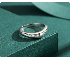 Detailed view of polished S925 silver wave ring featuring five micro-set sparkling diamonds
