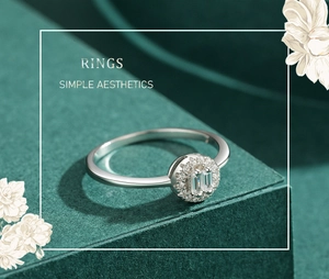 Detail of s925 silver ring featuring baguette-cut diamonds on an elegant green base