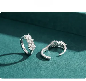 Detail of S925 sterling silver hoop earrings with marquise and baguette zircons