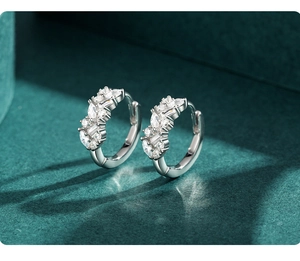 Detailed macro view of S925 sterling silver hoop earrings with mixed-cut cubic zirconia