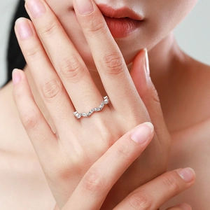 Elegant wavy S925 sterling silver ring with marquise-cut zircons worn by a model