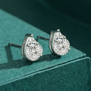 Elegant s925 silver teardrop stud earrings with pavé crystals on dark green jewelry box
