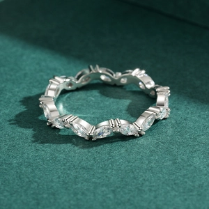 Elegant s925 silver marquise-cut zircon eternity ring on a textured dark green background