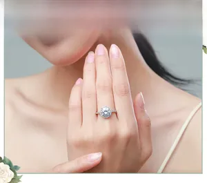 Close-up of luxury 5-carat halo engagement ring worn on hand with silver diamond band
