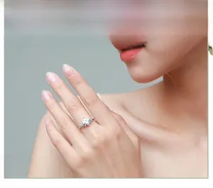 Close-up of S925 sterling silver ring featuring a star-cut zircon on a model hand
