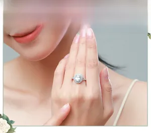 Close-up of S925 silver ring featuring 5ct oval-cut faux diamond in double halo setting