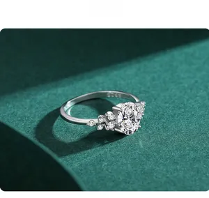 Macro shot of S925 sterling silver ring with oval cut zircon on green pedestal