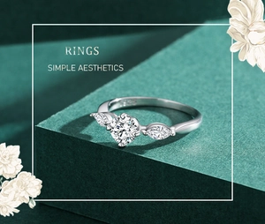 Macro detail of S925 silver three-stone ring with marquise cut accents and round center stone