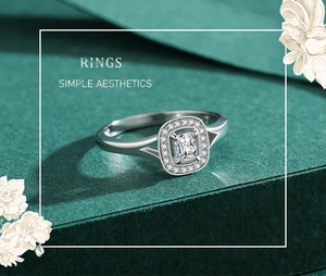 Macro shot of silver ring with emerald-cut zirconia and split shank halo setting