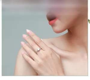 Close-up of S925 sterling silver 1 carat simulated diamond ring on model finger