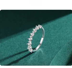 Macro detail of S925 sterling silver stacking ring with pave-set round clear gemstones