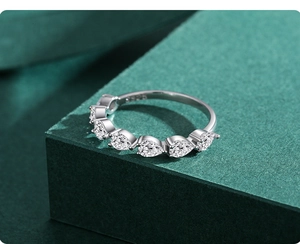 Detailed view of S925 sterling silver stamp and seven pear-cut stones in a prong setting