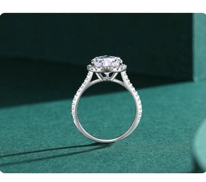 Macro view of halo-set S925 sterling silver ring with brilliant round center stone