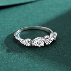 Elegant S925 sterling silver ring featuring five pear-cut sparkling stones on a green base