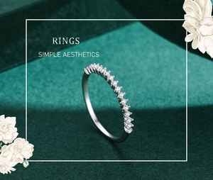 Detail view of a sparkling s925 silver eternity ring on an elegant green background