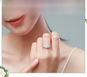 Close-up of elegant S925 sterling silver ring with pear-shaped zircon on a model's finger